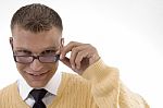 Student Adjusting His Spectacles Stock Photo