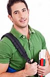 Student Carrying Bag And Books Stock Photo