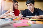 Student Couple Doing Homework With Laptop At Home Stock Photo