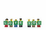 Studio Shot Of Lego Minifigure Holding Word Love You On White Background Stock Photo