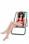 Stylish Female Bikini Model Relaxing In Canvas Chair Stock Photo