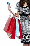 Stylish Woman Walking With Shopping Bags And Credit Card Stock Photo
