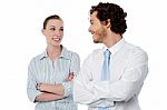 Successful Business Couple With Arms Crossed Stock Photo