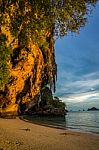 Sunlight Reflecting On A Cliff Face Around A Bay Stock Photo