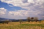 Sunny Spring In Mountain Village. Fields And Hills Stock Photo