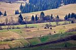 Sunny Spring In Mountain Village. Fields And Hills Stock Photo