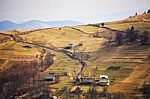 Sunny Spring In Mountain Village. Fields And Hills Stock Photo