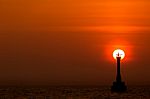 Sunset Behind The Lighthouse Stock Photo