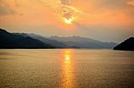 Sunset Over A Mountain At Lake Stock Photo