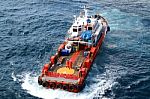 Supply Boat Transfer Cargo To Oil And Gas Industry Stock Photo