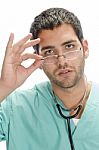 Surgeon Holding Spectacles Stock Photo