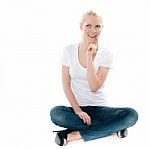 Surprising Young Woman Sitting Stock Photo