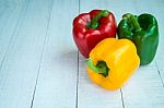 Sweet Pepper On Wooden Background Stock Photo