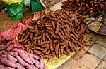 Sweet Potato Stack On Ground For Sale At The Market Stock Photo