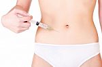 Syringe On Woman's Stomach Stock Photo