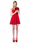 Tall Sexy Girl Holding Heart Shaped Gift Stock Photo