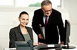 Team Of Two Business Executives Working In Office Stock Photo