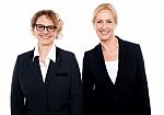 Team Of Two Smiling Businesswomen Posing Stock Photo