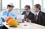 Team Of Young And Senior Engineering Man Project Meeting In Working Office For Project Discussion Stock Photo