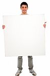 Teenage Boy Holding Blank Board Stock Photo