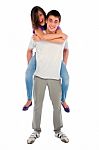 Teenage Boy Piggybacking Girl Stock Photo