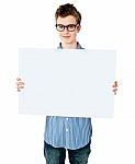 teenage Boy Showing Empty board Stock Photo