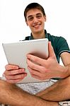 Teenage Boy Using Ipad Stock Photo