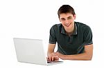 Teenage Boy Working With Laptop Stock Photo