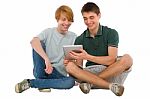 Teenage Boys Using Ipad Stock Photo