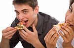 Teenage Couple Eating Pizza Stock Photo