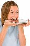 Teenage Girl Biting Tablet Pc Stock Photo