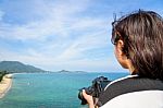 Teenage Girl Is Holding Camera On High Stock Photo