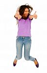 Teenage Girl Jumping With Thumbs Up Stock Photo