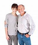 Teenager And Grandfather, In Studio Stock Photo