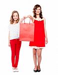 Teenagers Giving Shopping Bag Stock Photo