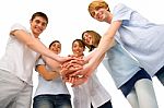 Teenagers With Hands Together Stock Photo