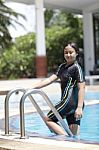 Ten Years Old Girl Playing In Swimming Pool Stock Photo