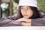 Thai Adult Girl White Cap Gray T-shirt Beautiful Girl Relax And Smile Stock Photo