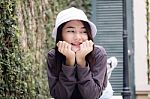 Thai Adult Girl White Cap Gray T-shirt Beautiful Girl Relax And Smile Stock Photo