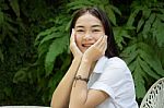 Thai Adult Student University Uniform Beautiful Girl Relax And Smile Stock Photo