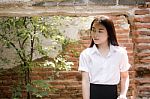 Thai Adult Student University Uniform Beautiful Girl Relax And Smile Stock Photo