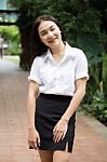 Thai Adult Student University Uniform Beautiful Girl Relax And Smile Stock Photo