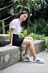 Thai Adult Student University Uniform Beautiful Girl Relax And Smile Stock Photo