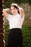 Thai Adult Student University Uniform Beautiful Girl Relax And Smile Stock Photo