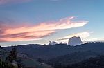 The Beauty Of The Sky When Light Hits The Clouds And Mountain Stock Photo