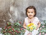 The Girl Was Sitting Among The Flowers Stock Photo