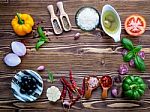 The Ingredients For Homemade Pizza On Shabby Wooden Background Stock Photo