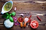 The Ingredients For Homemade Pizza On Shabby Wooden Background Stock Photo