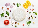 The Ingredients For Homemade Pizza On White Wooden Background Stock Photo