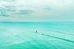 The View Of The Sand Beach And Sea Wave With Rock And Cloudy On The Afternoon Stock Photo